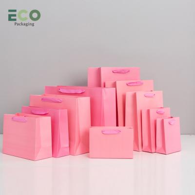 China Recyclable Customised Cloth Boutique Cardboard Packaging Brand Matte Cheap Pink Gift Paper Bag with Your Own Logo For Small Business for sale