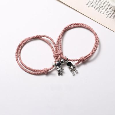 China TRENDY Astronaut 2Pcs Lovers Matching Friendship Rope Braided Couples Distance Magnetic Bracelet Kit Lover Jewelry for sale