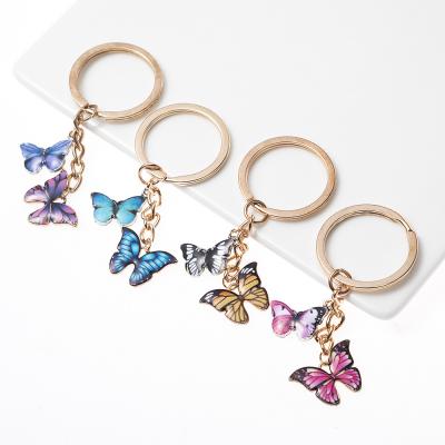 China FASHIONABLE Colorful Double Butterfly Ring Stand Charm Fashion Insect Single Key Chain Bag Key Chain Pendant Jewelry for sale