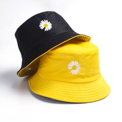 China Sun protection women bucket fishing spring lady fisherman hat double-sided wear small daisies sun hat sunscreen hats for sale