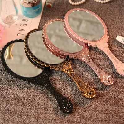 China Hand Held Vintage Carved Makeup Salon Vanity Handle Lighted SPA Cosmetic Mirror For Women for sale