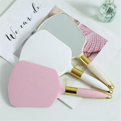 China Vintage Hand Lighted SPA Salon Makeup Handheld Vanity With Handle Cosmetic Mirror For Women for sale