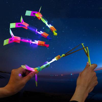 China 12Pcs Flashing Led Lighting Up Luminous Toy Slingshot Flying Toys Christmas Decor Light Fast Catapult for sale