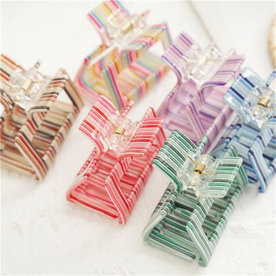 China Newspaper use new CLARMER 2022 spring fashion women hair claw wholesale cheap color acrylic hair clip decorative new design factory for sale