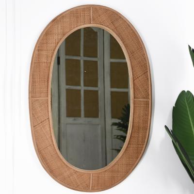 China Beautiful Handmade Minimalism Rustic Oval Rattan Detail Wall Hanging Natural Boho Weaving Mirror for sale