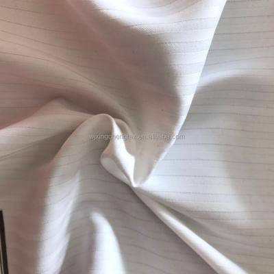 China 75*75 Yarn Count 100% Polyester Jacquard Fabric for Lady Dress in White Color for sale