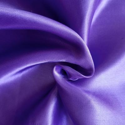 China Flame Retardant 100% Polyester Woven Gold Satin Fabric For Apparel for sale