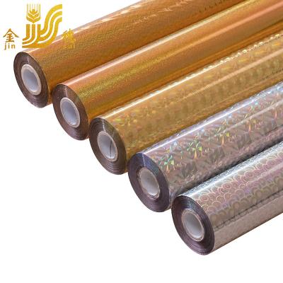 China Paper JINSUI PET Printed Laser Holographic Plastic Gold Foil Hot Stamping Foil Roll For Cosmetic Bottles Packaging for sale