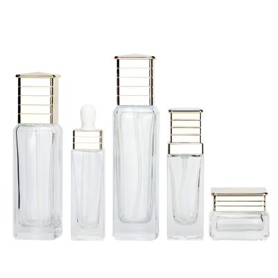 China Wholesale Recycable Clear Square Glass Skin Care Packaging Cream Jars Cosmetic Pump Essential Oil Dropper Bottle With Customize Logo for sale