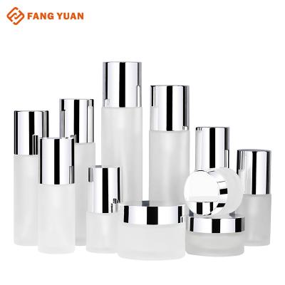 China Wholesale Full Set Stock Glass Cylinder Bottle Skin Care Packaging Lotion Pump Bottle Cream Frosted Jar With Silver Cap for sale