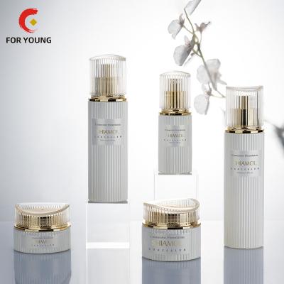 China Custom logo 1oz/50g cosmetic luxury special empty cylinder design skin care packaging bottle set with cosmetic jar lotion pump /sprayer for sale