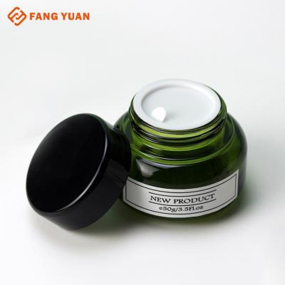 China Wholesale New Design High Grade Green Skin Care Glass Cream Jar Bottle OEM Stock Simple Color Cosmetic Packaging Bottle Set for sale