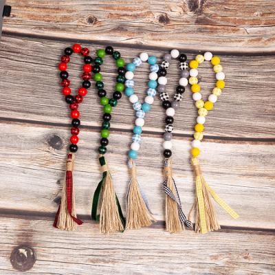 China Minimalist DIANJIN Farmhouse Handmade Wood Beads Tassel Garland for sale