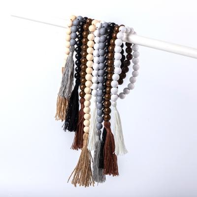 China Minimalist DIANJIN Diy Handmade Decoration Home Decor Wood Beads Tassel Garland for sale