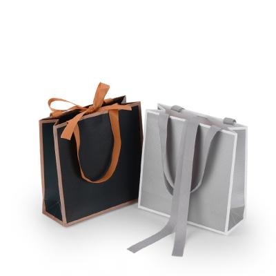 China Recycled Materials Ready To Ship Small Paper Bags With Ribbon Handles Luxury Gift Bags For Shopping for sale