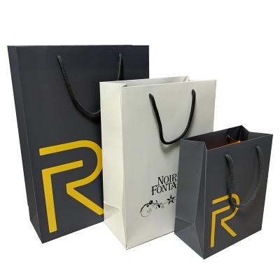 China Recycled Materials Logo Printed Matt Finish White Custom Large Boutique Paper Bags for sale