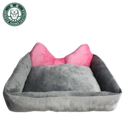 China The cute bow-shaped heating dog bed is comfortable and machine washable for sale