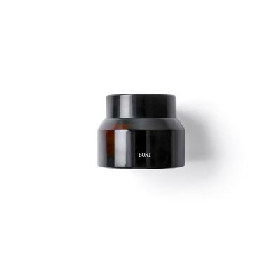 China Personal care in luctury 15G 30G 50G 50ml stock oblique shoulder amber glass cream jar with black lid for body cream for sale