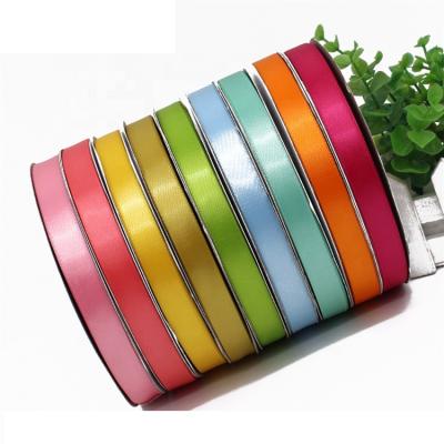 China Custom Bright Color Fastness Promotional Price 5/8inch 1.5cm Single Sided High Density Polyester Ribbon For Party Favors for sale