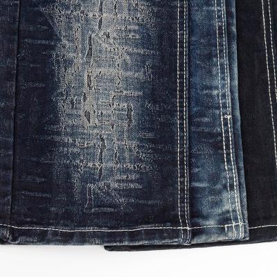 China Breathable Low Stretch Jeans Fabric 1.1% 70% Cotton 26% Polyester Spandex 2.9% Rayon Jacquard Selvedge Fabric Denim Material for sale