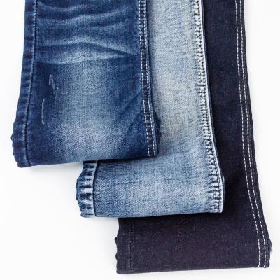 China Breathable Wholesale 98% Cotton 2 Spandex 9.4oz Light 4 Way Denim Fabric Selvedge Faux Knit Stretch Lattice Fabric for sale