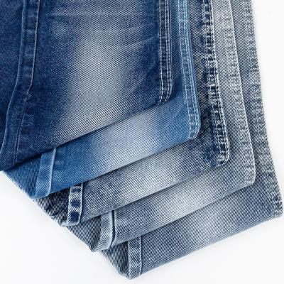 China Breathable Denim Fabric Wholesale Lightweight Twill Jeans Material 65% Cotton 33% Polyester 2% Spandex 8.3oz OE Selvage Knit Denim Fabric for sale