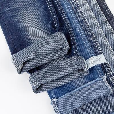 China Breathable Lightweight Denim Fabric Twill Jeans Material 65% Cotton 33% Polyester 2% Spandex 8.3oz OE Selvedge Knit Denim Fabric Wholesale for sale