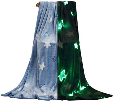 China PORTABLE 280gsm flannel glow in the dark throw blanket with stars moon spaceship and cosmic creature for sale