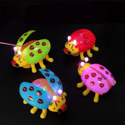 China Halloween Styles Amazon Hot Selling Colorful Durable Toys For Children Electric LED Ladybug Toys With Music Instant Pull Toys Wholesale for sale