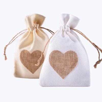 China Fashionable Heart Shaped White Canvas Drawstring Bags Folding Favor Candy Packaging Wedding Gifts For Jewelry for sale