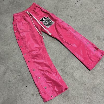 China Men's Baggy Fit Nylon Sweatpants with Windproof Design and Distressed Embroidery for sale