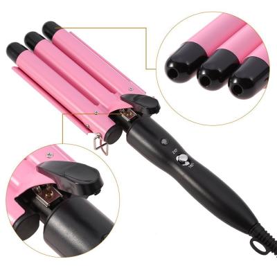 China 199 Household 3 barrel waver curling iron pink anti-scalding heat three tube ceramic hair curler for sale