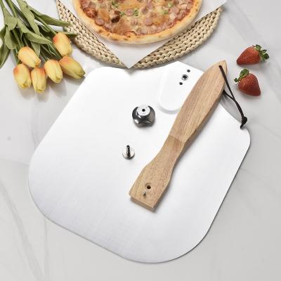 China Viable Foldable Metal Pizza Cutter Accessories Tools Pizza Skins Peel Set Aluminum Pizza Skin With Wood Handle for sale