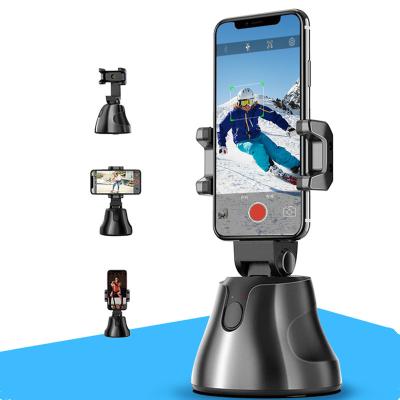 China Adjustable Auto Follow Smart Object Mobile Phone Mount Holder 360 Degree Rotation Shooting Face Tracking Smart Tripod Phone Holder for sale