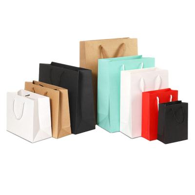 China Recyclable Paper Bag Custom Printed Logo Cardboard Packaging Gift Wrapping Paper Carrier Bag Shopping Paper Bags Clothing for sale