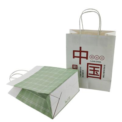 China Recycled Materials Take Away Gift Bag Business Paper Packaging Shopping In Stock Bag White Kraft Paper Bag With Handle for sale