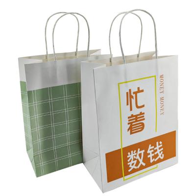 China Recycled Materials In Stock White Kraft Paper Bag Shopping Take Away Gift Paper Packaging Bag With Handle for sale