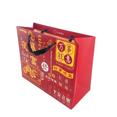 China Newest Gift Fancy Biodegradable Art Paper Packaging Bag With Ribbon Custom Blessing Handle For Business Shopping Tote Bag for sale