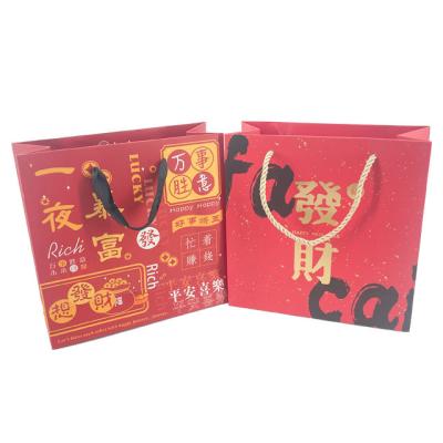 China Custom Biodegradable Cheap Price Blessing Gift Art Paper Packaging Bag With Ribbon Handle For Business Shopping Tote Bag for sale