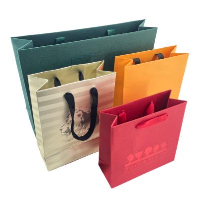 China Custom Luxury Gift Packaging Bag Biodegradable Special Paper With Handle Business Shopping Kraft Paper Bag for sale