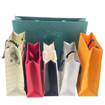 China Biodegradable Custom Business Shopping Gift Paper Bag Wedding Packaging Special Paper Packaging Bag Luxury for sale