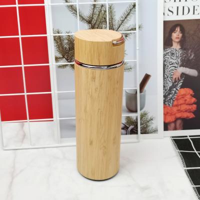 China Temperature Display 500ML Bamboo Cover with Stainless Steel Assortment and Double Wall Insulated Water Bottle with Stainless Steel Strainer and Lid for sale