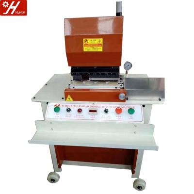 China Cutting and punching are at the same time YH-34 hydraulic press completed leather belt holes punching machine leather belt making machine for sale