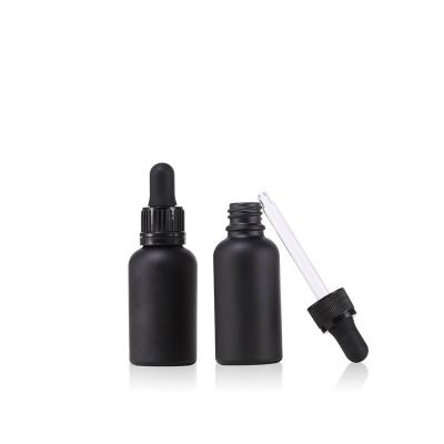 China Dropper Bottles Glass Cosmetic Pipette With Matte Black Dropper Bottle Cosmetic Packaging 1OZ Round Black Frosted Glass Dropper Bottle for sale