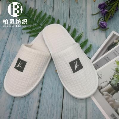 China Cheap Disposable Waffle Slipper Wholesale Disposable Unisex Open-Closed Toe Slipper Custom Manufacturer Logo for sale