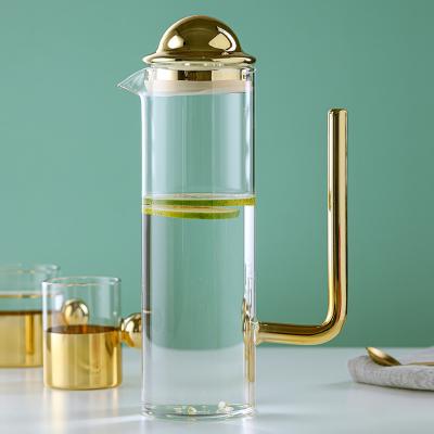 China Modern Minimalist Transparent Glass Water Wine Kettle Sustainable Glass Water Set Cold Boiled Water Trace Gold Kettle for sale