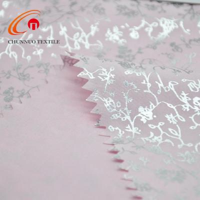 China Chunnuo Shaoxing anti-static textile 100% polyester stamp satin woven high quality silver fabrics for sale