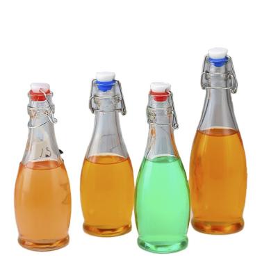 China Beverage Factory Wholesale OEM 12oz 350ml Beverage Juice Wine Milk Bottle ES37 Swing Top Glass Bottle for sale