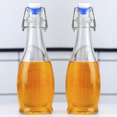 China Beverage Factory Wholesale OEM 12oz 350ml Beverage Juice Wine Milk Bottle ES37 Glass Bottle With Buckle for sale