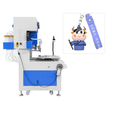 China PVC Silicone Rubber Keychain Making Machine 18 Colors Automatic Dispensing Machine for sale